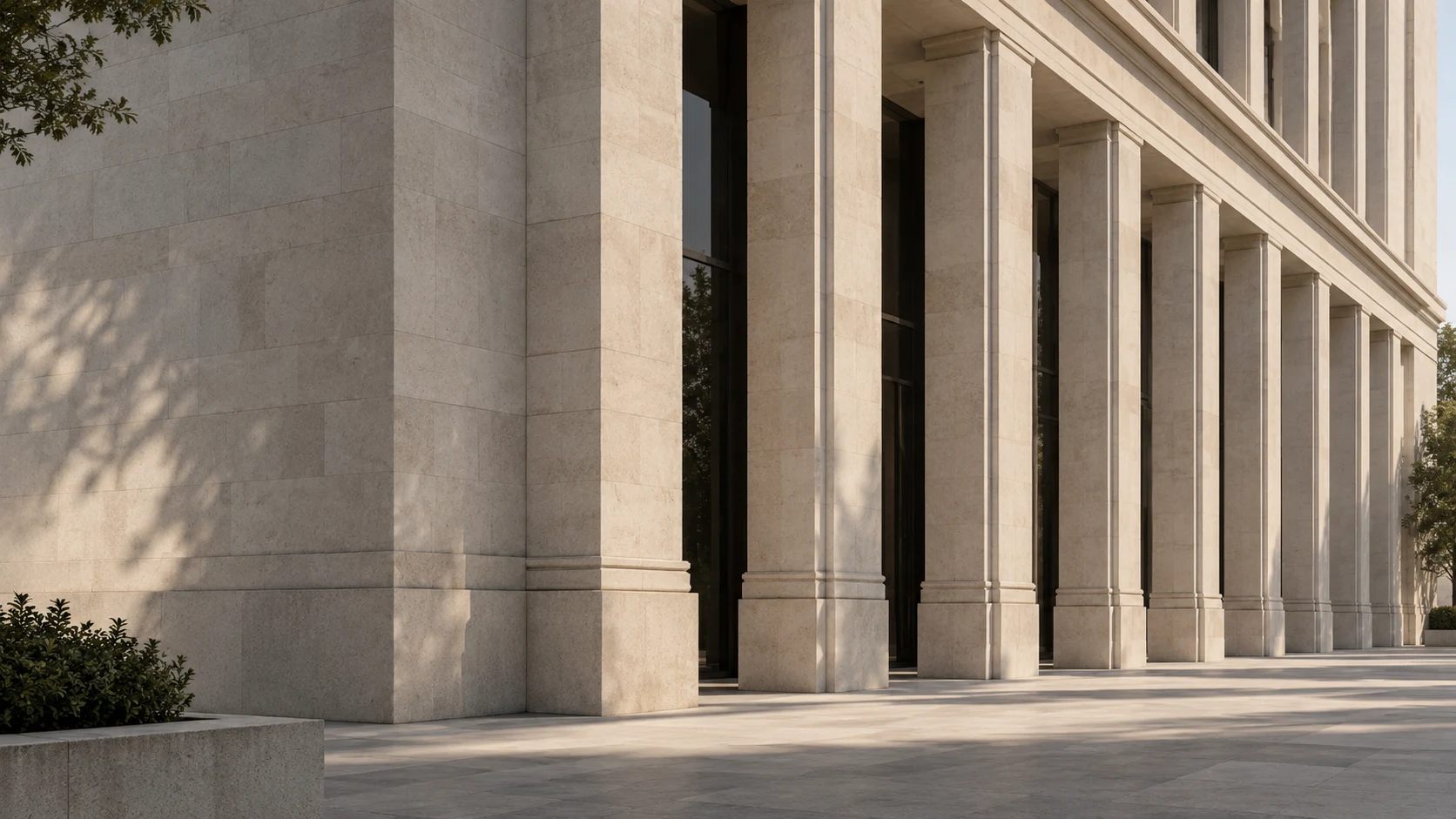 Sunlight and shadow across a limestone colonnade
